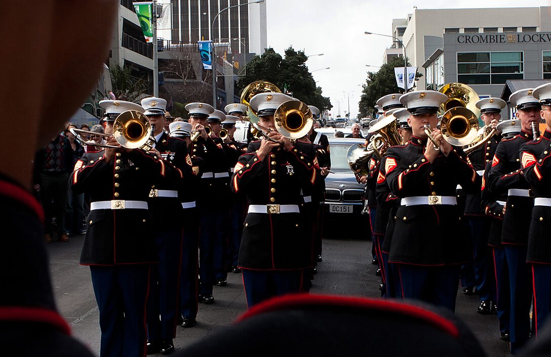 Gunnery Sgt. Brad Rehrig, drum major, U.S. Marine Corps Forces, Pacific Band, leads the band through the streets during a parade in New Plymouth, New Zealand on Sept. 10. The parade kicked off the celebration commemorating the 70th anniversary of the Marines landing in Wellington in 1942. (Official USMC photo by Lance Cpl. Isis M. Ramirez/released)