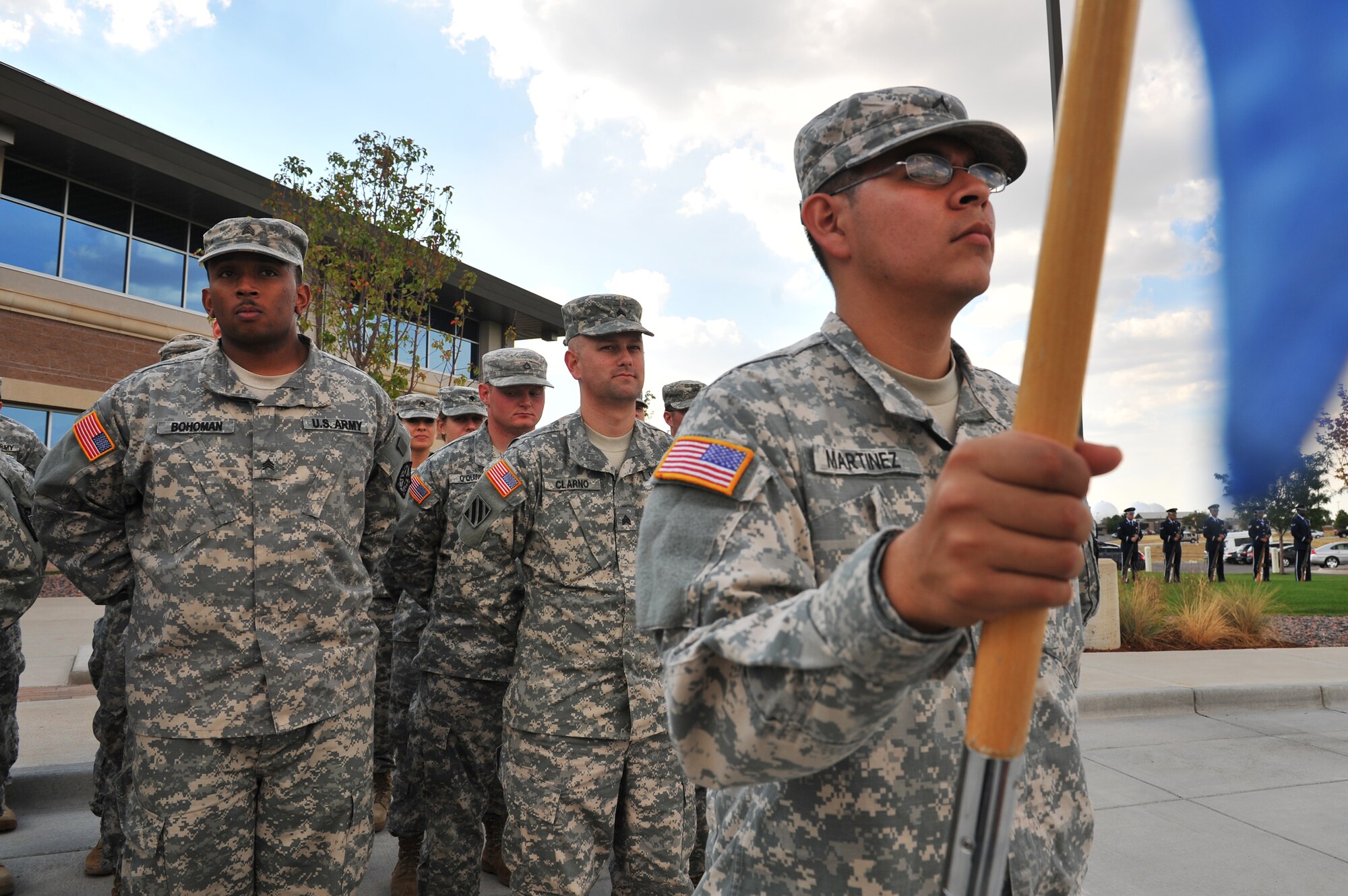 BUCKLEY AIR FORCE BASE, Colo. -- U.S. Army Pvt. Anthony Martinez, 743rd Military Intelligence Battalion, holds the standard for his formation Sept. 9, 2011. Soldiers gathered at the base flag to observe Team Buckley's Patriot Day Ceremony in observance of the tenth anniversary of the 9/11 attacks. (U.S. Air Force photo by Staff Sgt. Kathrine McDowell)  