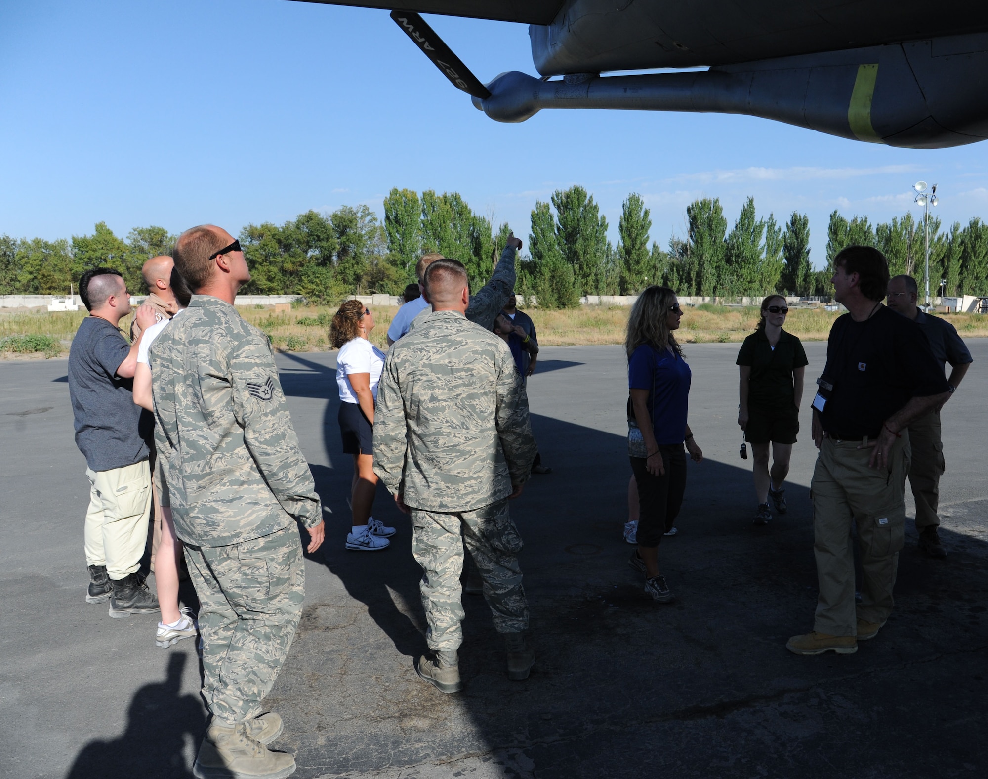 Outback Steakhouse Inc. employees get a tour of a KC-135 Stratotanker during their visit as part of Operation Feeding Freedom IX to the Transit Center at Manas, Kyrgyzstan, Sept. 5. Outback Steakhouse employees prepared more than 7,000 steaks for service members at the Transit Center. Through Operation Feeding Freedom, Outback Steakhouse Inc. employees have provided meals to service members deployed to Djibouti, Afghanistan, Iraq, Southwest Asia, Kyrgyzstan and the USS Nimitz. (U.S. Air Force photo/Tech. Sgt. Hank Hoegen)  