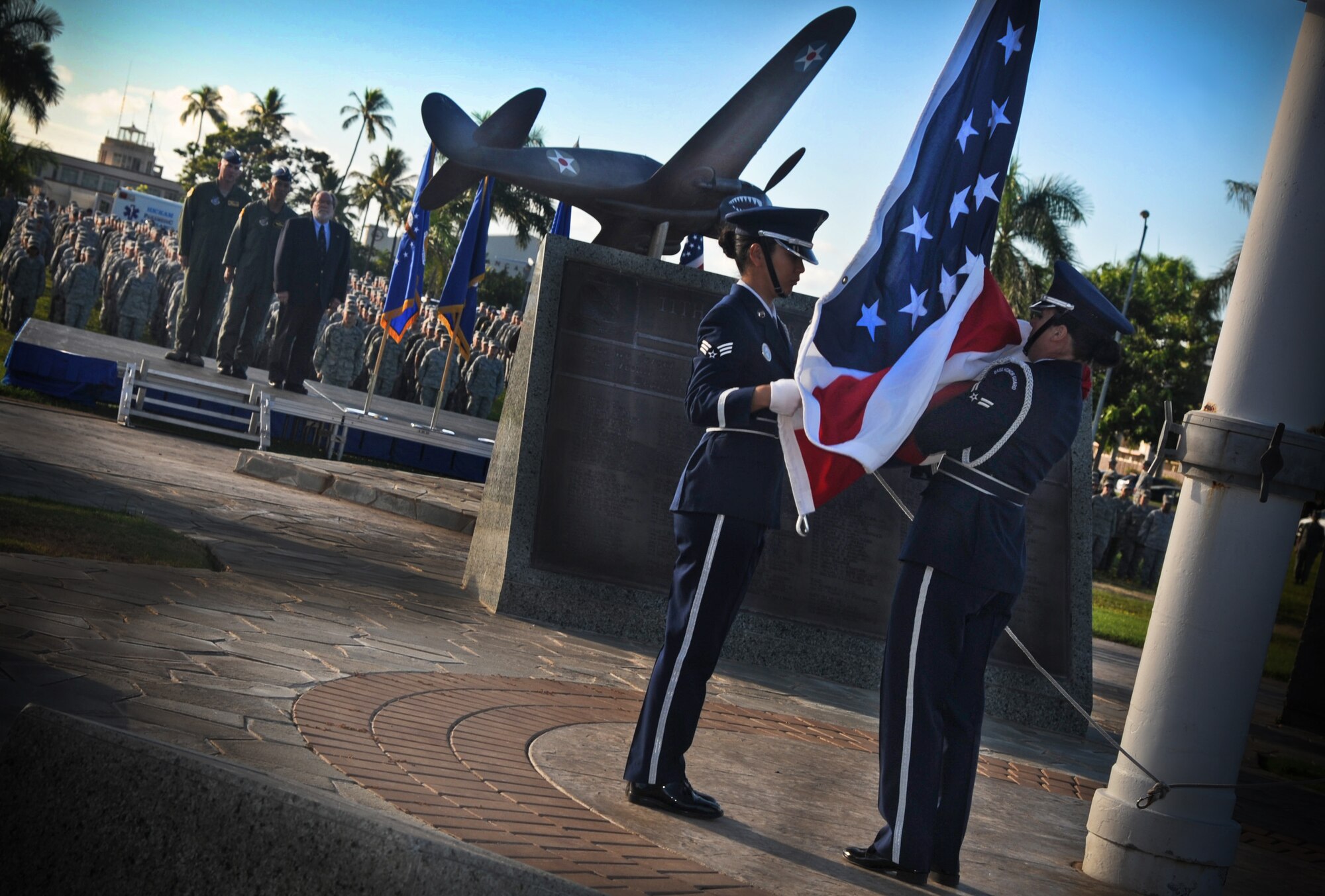 Joint Base Pearl Harbor-Hickam honor guard raise the flag during a Sept. 11 remembrance ceremony at Atterbury Circle, Sept. 9. The ceremony included speeches from Hawaii Governor Neil Abercrombie, Brig. Gen. Joseph Kim, deputy adjutant general, and Col. Sam Barrett, 15th Wing commander. (U.S. Air Force photo/Senior Airman Lauren Main)