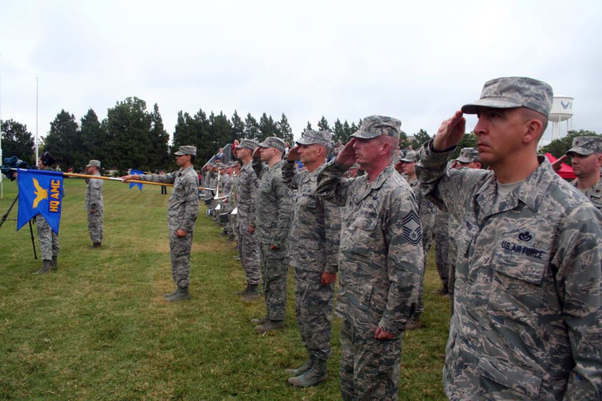 Airmen salute Sept. 9, 2011, at Scott Air Force Base, Ill., during a retreat ceremony recognizing the 10th anniversary of the Sept. 11, 2001, attacks. (U.S. Air Force Photo/Master Sgt. Scott T. Sturkol) 