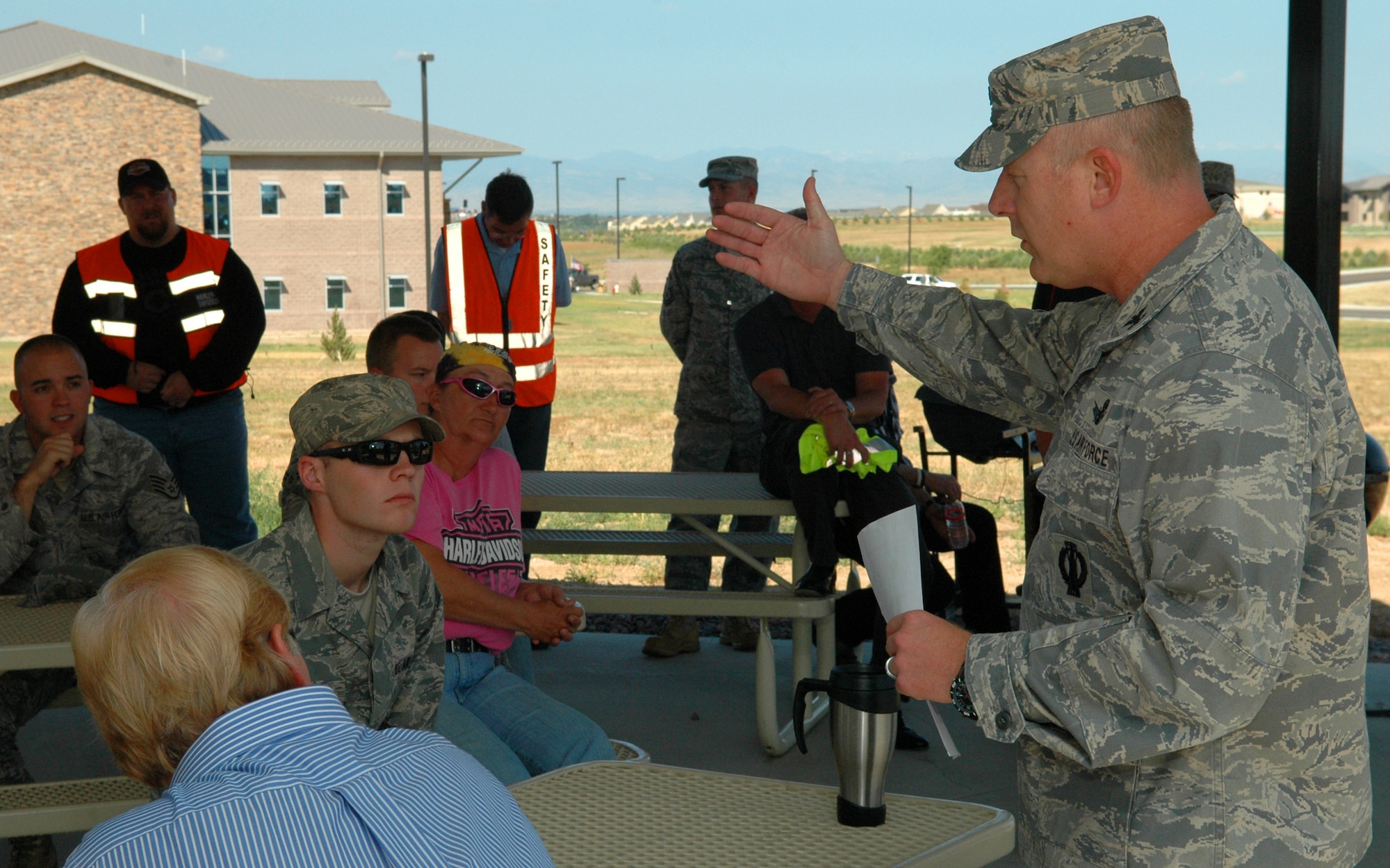 BUCKLEY AIR FORCE BASE, Colo. – Colonel Daniel Dant, 460th Space Wing commander, explains the necessary safety precautions service members should follow while taking the motorcycle safety ride Aug. 31 2011. (U.S. Air Force photo taken by Airman Nigel R. Sims)