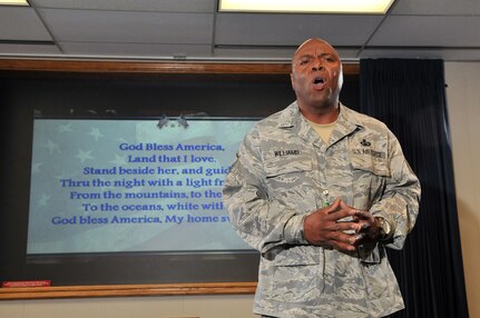 Master Sgt. Kerry Williams of the Air Force Intelligence, Surveillance and Reconnaissance Agency Chaplain's Office, sings "God Bless America" Sept. 9 to wrap up the organization's 9/11 10th Anniversary Observance. (Photo by William Belcher)            
