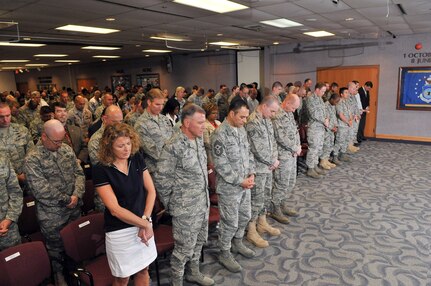 Members of the Air Force Intelligence, Surveillance and Reconnaissance Agency pause for a prayer Sept. 9 in the AFISRA headquarters auditorium, during the organization's 9/11 10th Anniversary Observance. (Photo by William Belcher)

