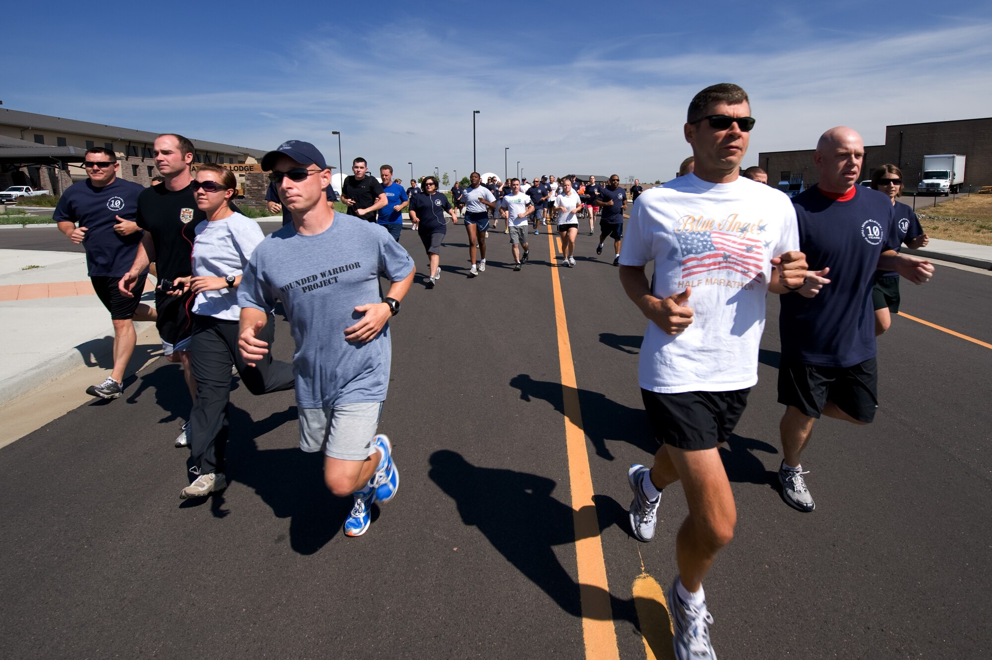 BUCKLEY AIR FORCE BASE, Colo. -- Members of Team Buckley begin the Buckley Remembers 5k on Sept. 9, 2011.  Service members run in remembrance of the ten year anniversary of the 9/11 attacks. (U.S. Air Force photo by Airman 1st Class Phillip Houk)