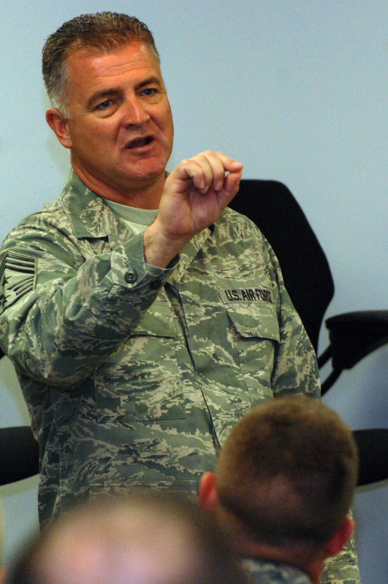 DOVER AIR FORCE BASE, Del. -- Chief Master Sgt. Troy McIntosh, command chief master sergeant for Air Force Reserve Command, speaks to a group of about 100 Airmen during a 512th Airlift Wing chief's panel here. The open question-and-answer forum was part of the AFRC wing's first-ever Airmen's Weekend held during a unit training assembly Nov. 1, 2008. (U.S. Air Force photo/Staff Sgt. Steve Lewis)