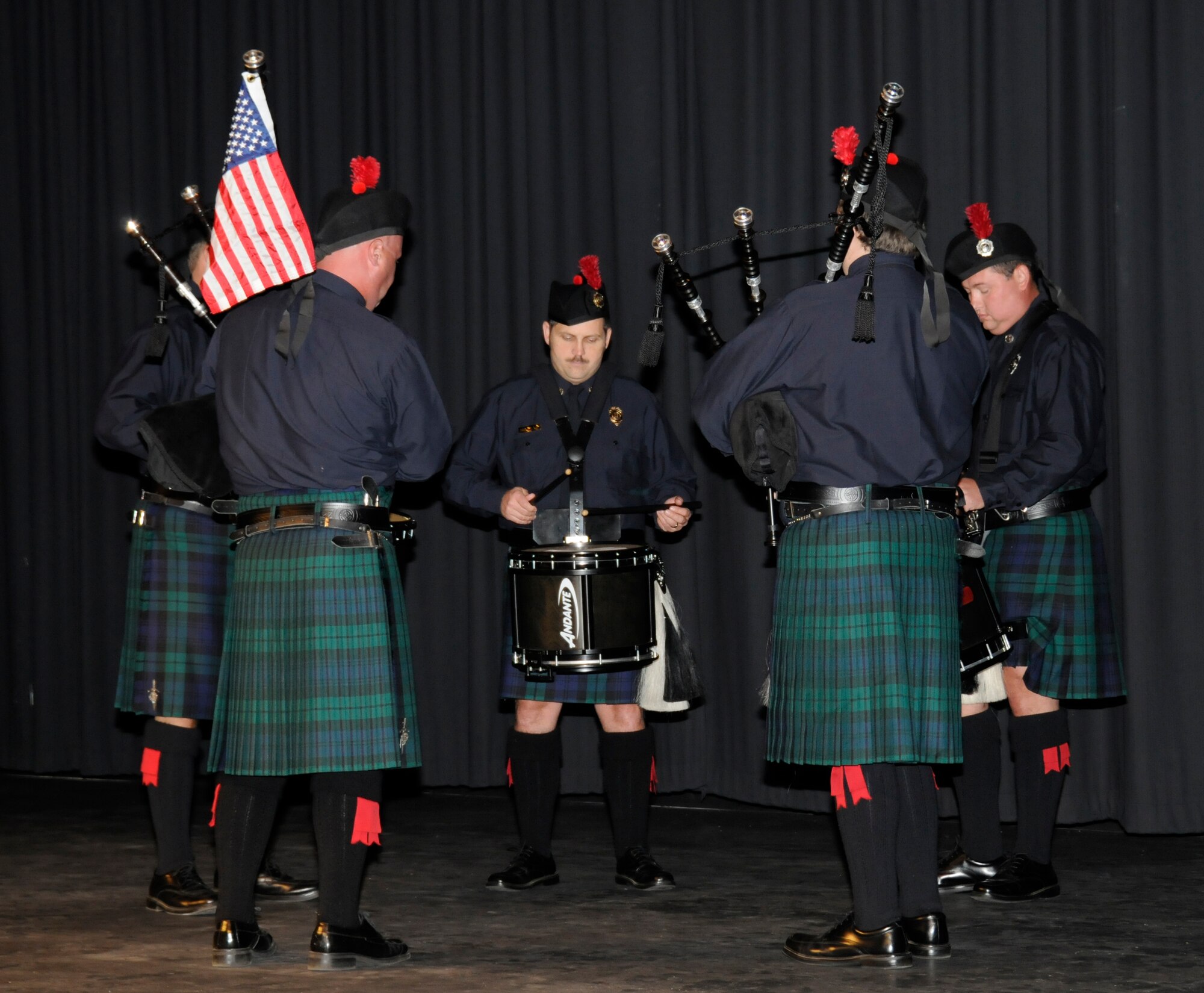 Members of the Fort Smith Fire Department perform “Amazing Grace” with bagpipes during a  Sept. 11, 2001, remembrance gathering at the University of Arkansas-Fort Smith Sept. 9, 2011. Col. Tom Anderson, 188th Fighter Wing commander, was a guest speaker during the event, which remembered all those Americans who lost their lives during the terrorist attacks 10 years ago. The event also featured representatives from UAFS, the Fort Smith Fire Department and Fort Smith Police Department. The Fort Smith Fire Department Honor Guard posted the colors during the event. (U.S. Air Force photo by Capt. Heath Allen/188th Fighter Wing Public Affairs)
