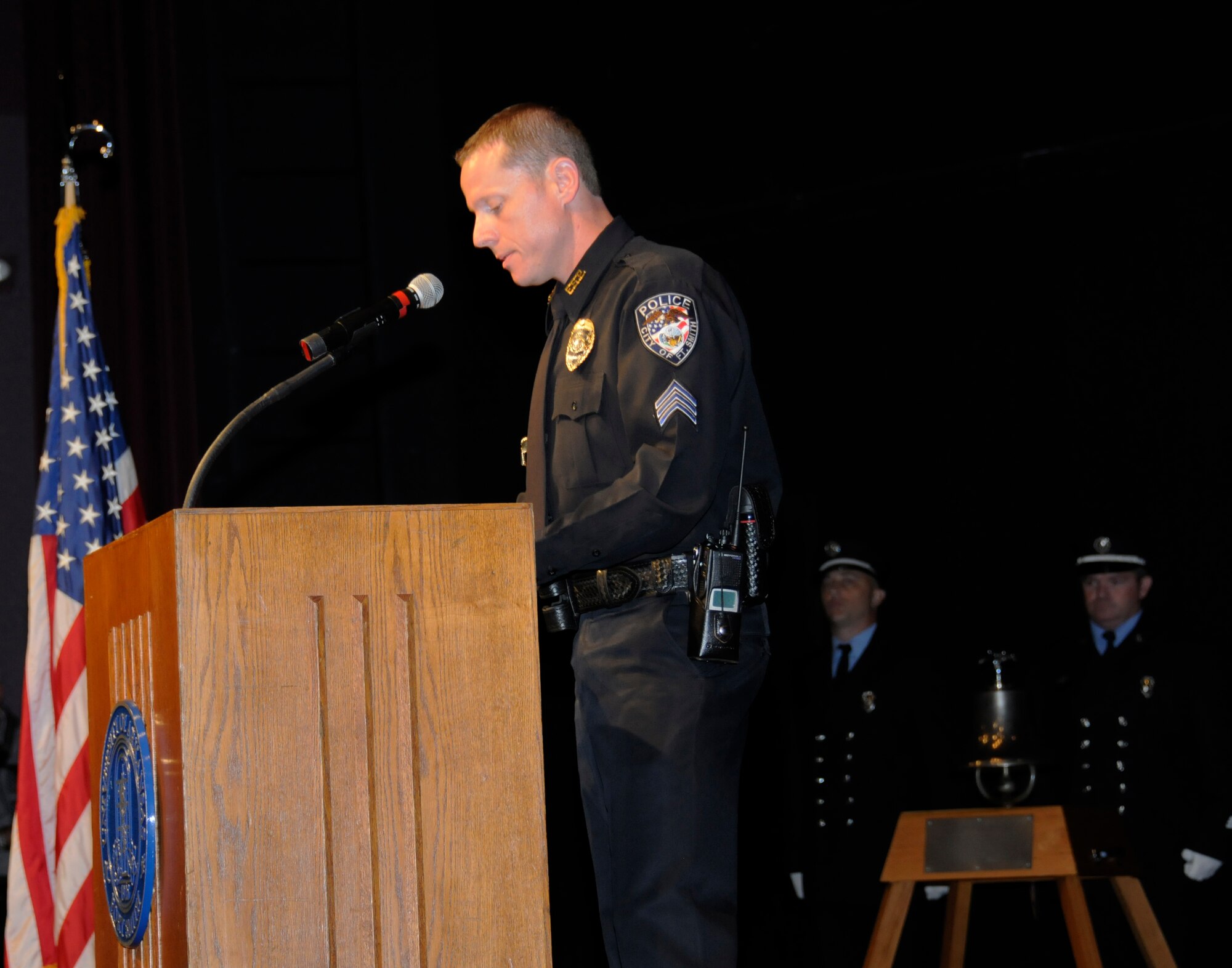 Sergeant Daniel Grubbs with the Fort Smith Police Department narrates during a Sept. 11, 2001, remembrance gathering at the University of Arkansas-Fort Smith Sept. 9, 2011. Col. Tom Anderson, 188th Fighter Wing commander, was a guest speaker during the event, which remembered all those Americans who lost their lives during the terrorist attacks 10 years ago. The event also featured representatives from UAFS, the Fort Smith Fire Department and Fort Smith Police Department. The Fort Smith Fire Department Honor Guard posted the colors during the event. (U.S. Air Force photo by Capt. Heath Allen/188th Fighter Wing Public Affairs)

