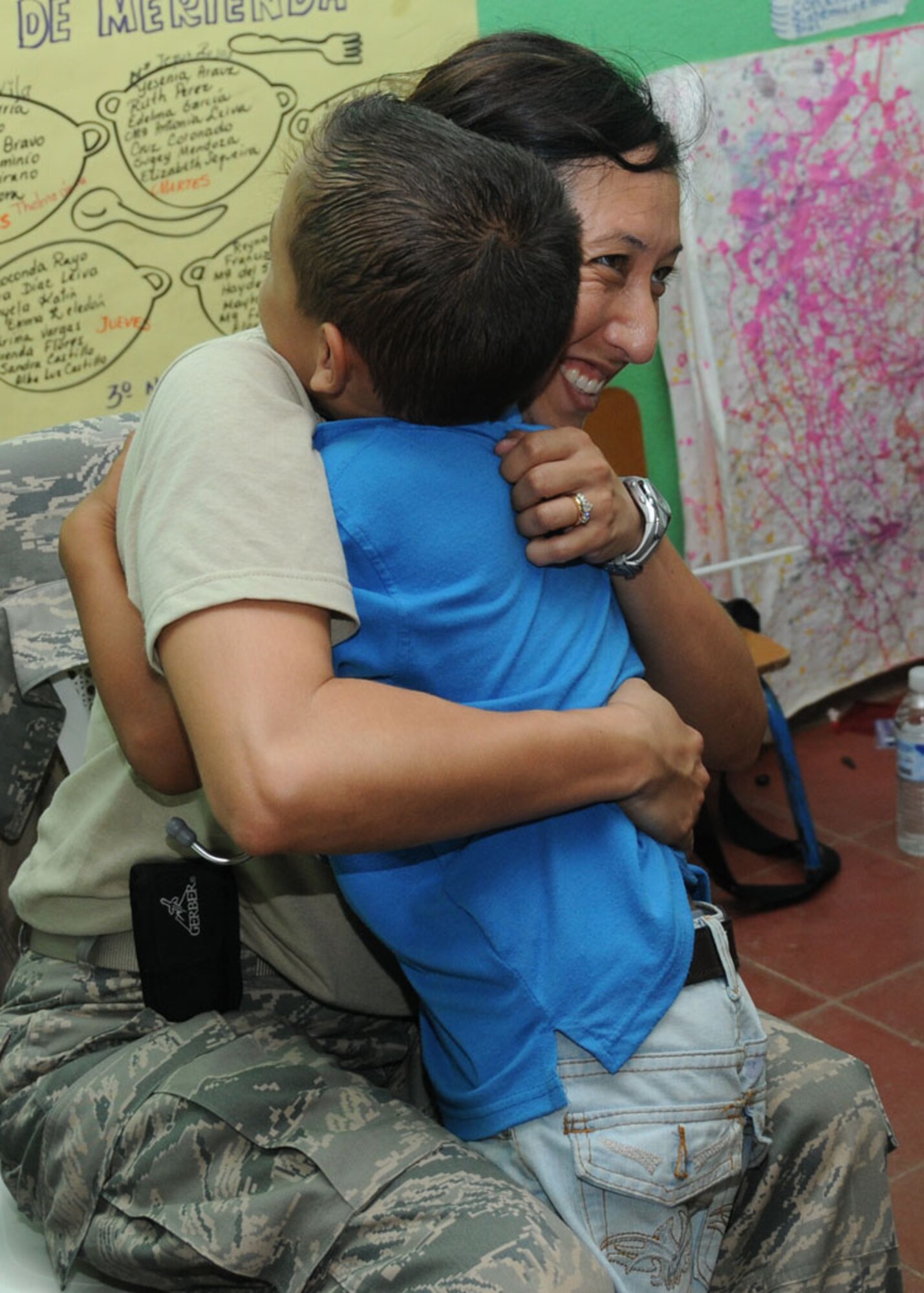Master Sgt. Kamille Resetz, a health services technician with the 916th Aerospace Medicine Squadron in North Carolina, receives a hug from a very satisfied patient here Aug. 8, 2011. The unit spent two weeks in Central America on a humanitarian mission called a Medical Readiness Training Exercise, called a MEDRETE. (USAF photo by Senior Airman Meredith A. H. Thomas, 916 ARW/PA)