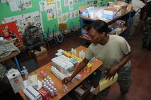 Senior Airman Natesha Fields, a medical technician with the 916th Aerospace Medicine Squadron in North Carolina, fills a prescription for a waiting patient here Aug. 8, 2011 during a Medical Readiness Training Exercise (MEDRETE). The pharmacy dispensed more than 12,500 prescriptions during the two-week mission. (USAF photo by Senior Airman Meredith A. H. Thomas, 916 ARW/PA)