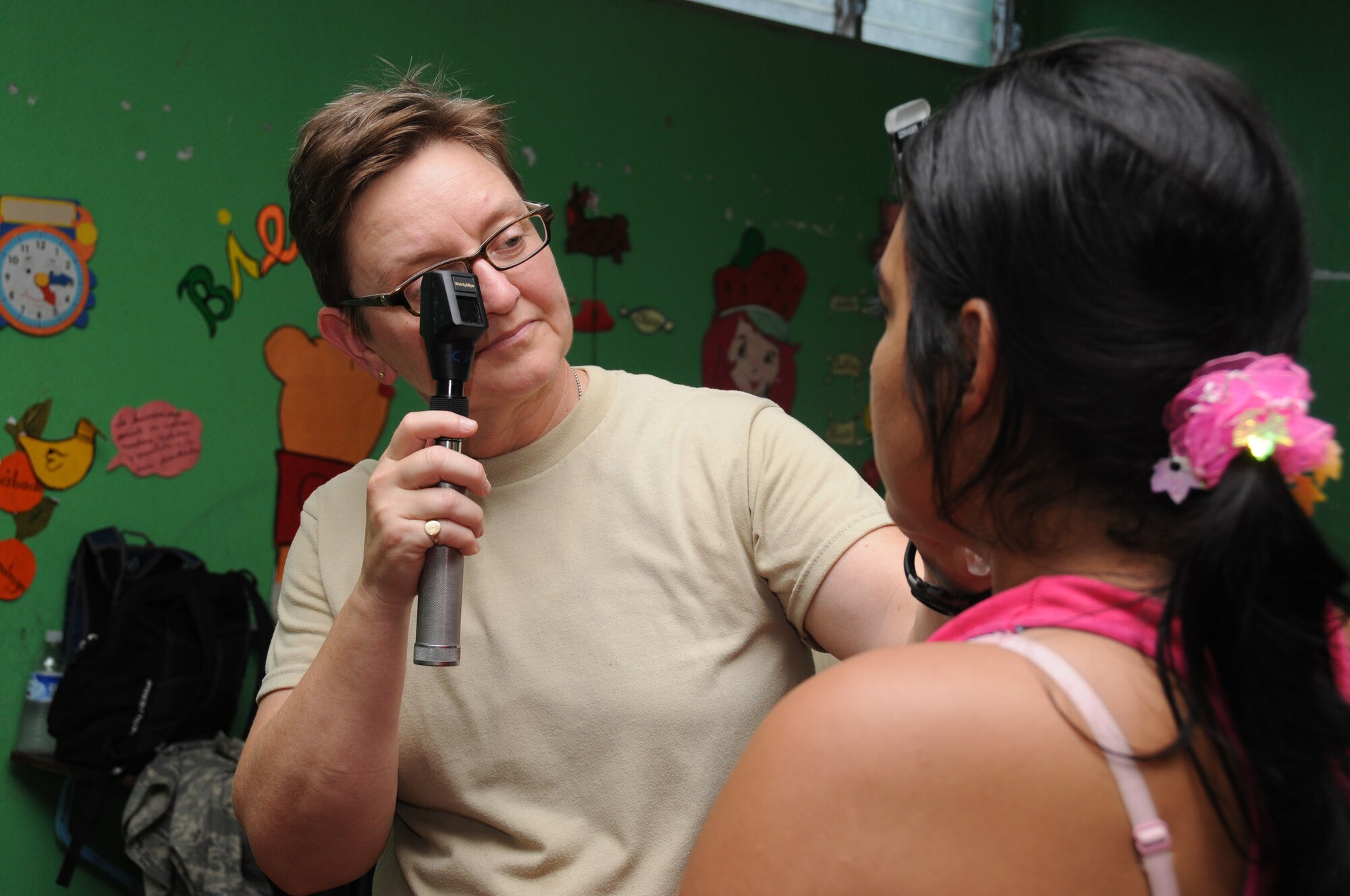 Maj. Barbara Wujciak, and optometrist with the 916th Aerospace Medicine Squadron at Seymour Johnson Air Force Base in North Carolina, evaluates the eyesight of a patient here Aug. 8, 2011. Wujciak was one of about 50 reservists from around the U.S. deployed to Nicaragua on a humanitarian mission. (USAF photo by Senior Airman Meredith A. H. Thomas, 916 ARW/PA)