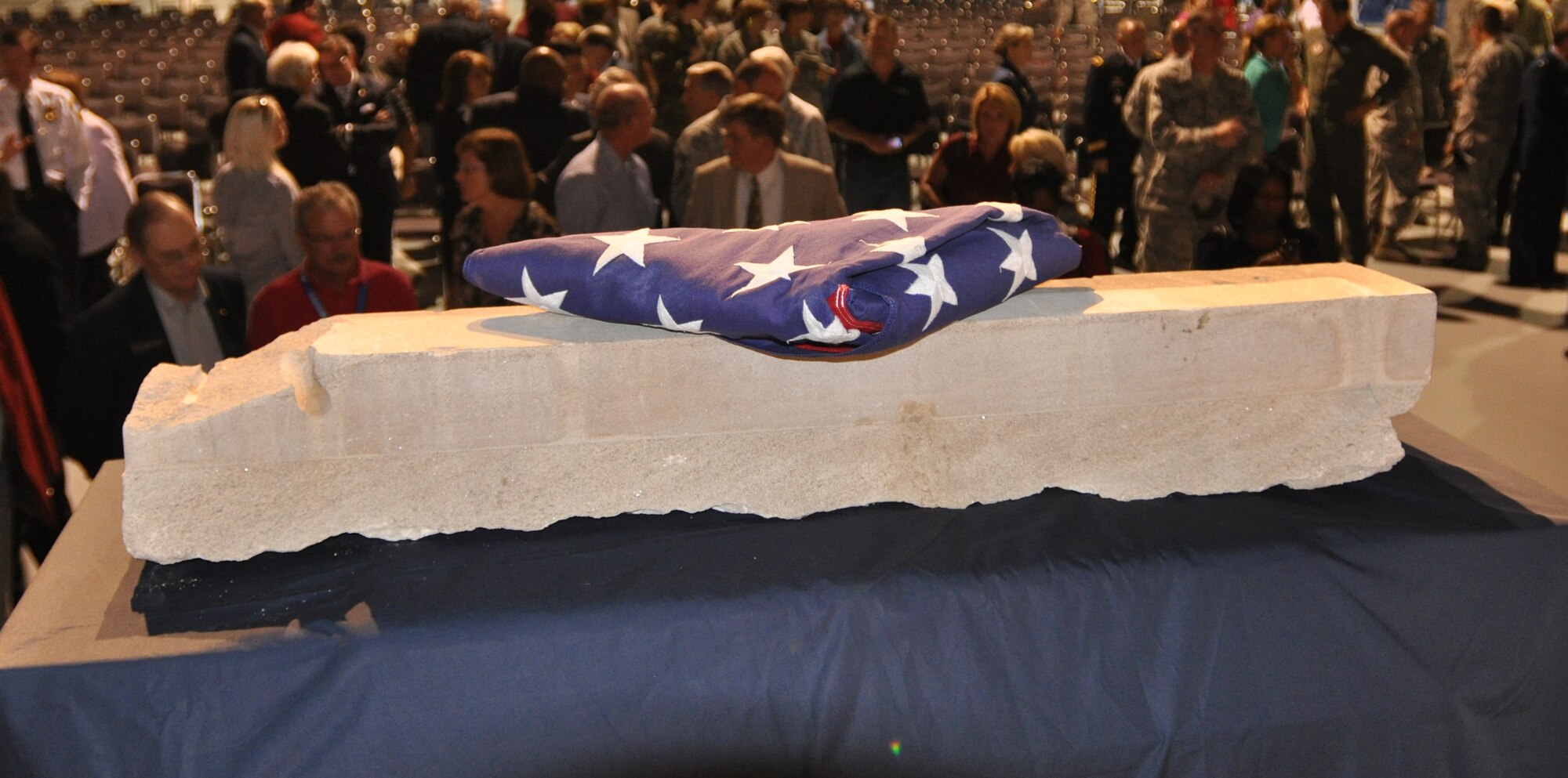 The 9/11 Pentagon stone, acquired by Air Force Reserve Command history office, is an artifact from the West Wall of the Pentagon that was hit by a hijacked airliner on 9/11.  The coordinated attacks that day killed 184 people at the Pentagon, another 2,749 at the World Trade Center and 40 aboard Flight 93 that crashed in Shanksville, Pa. Among the 9/11 fatalities was Air Force Reserve Maj. LeRoy Homer, first officer on Flight 93. The stone, approximately 40 inches long, 8 inches wide and six inches deep, represents the sacrifices of thousands of American men and women who gave their lives on 9/11. This stone also recognizes the men and women who serve in the U.S. military in defense of freedom. (U.S. Air Force photo/Philip Rhodes)
