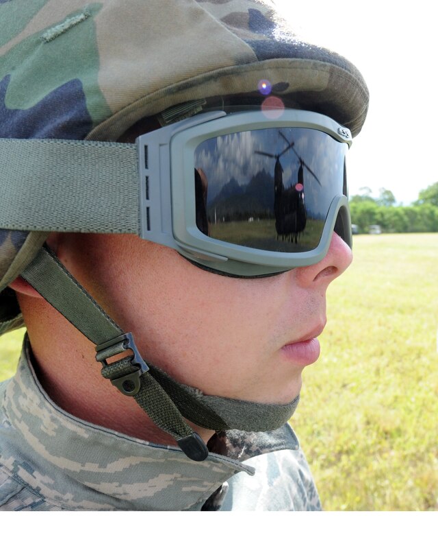 Staff Sgt. Journey Stahl, Army Forces fuels specialist, prepares to attach a Pre-positioned Expeditionary Assistance Kit, or PEAK to a Chinook Aug. 26, 2011, at Soto Cano Air Base, Honduras. The PEAK is a modular system that provides potable water, communications and power generation, and information sharing to first responders immediately following a disaster event. (U.S. Air Force photo/Tech. Sgt. Matthew McGovern)