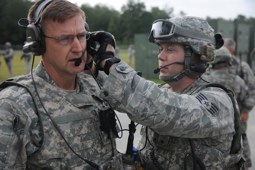 U.S. Air Force Staff Sgt. James Hicks, 823rd Base Defense Squadron (BDS) fireteam leader, right, prepares Maj. Gen. Stephen Hoog, 9th Air Force commander, with the proper equipment to conduct drills at Moody Air Force Base Ga., Sept 8, 2011. Hoog completed the drills with 823rd BDS to grasp a better understanding of their mission and what they bring to the defense force. (U.S. Air Force photo by Airman 1st Class Paul Francis/Released)