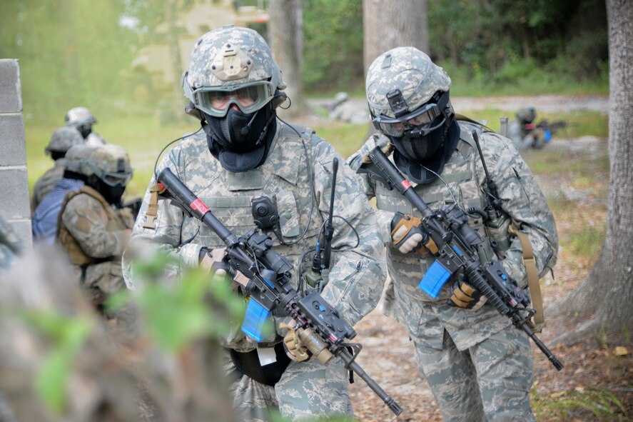 U.S. Air Force Maj. Gen. Stephen Hoog, 9th Air Force commander, left, and Chief Master Sgt. Robert Brooks, 9th Air Force command chief, participate in a demonstration at Moody Air Force Base, Ga., Sept. 8, 2011. Hoog and Brooks went through a series of drills that consisted of tactical walking, low crawling and aiming down his sight. (U.S. Air Force photo by Airman 1st Class Paul Francis/Released)
