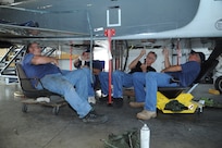 (Left to right) Jim Herwig, Michael Biggs, Bill Sousa and Mathew Zaionez, 571st Aircraft Maintenance Squadron Operating Location A, perform final operational checks to complete a depot-level modification to a T-38 Talon aircraft on Randolph Air Force Base Aug. 30. The squadron, an operating location out of Hill Air Force Base, Utah, performs depot-level maintenance on T-38s Air Force wide.(U.S. Air Force photo/Rich McFadden) (released)  