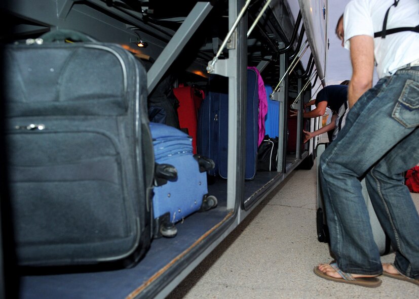 Airmen load their baggage onto busses Sept. 8, 2011 at the Fitness Center on Dyess Air Force Base, Texas, before heading to Nellis Air Force Base, Nev., to participate in exercise Green Flag. More than 130 Airmen from the 9th Bomb Squadron and 9th Aircraft Maintenance Unit will participate in the exercise to prepare Air Force and Army personnel for upcoming deployments. (U.S. Air Force photo by Airman 1st Class Jonathan Stefanko/ Released)