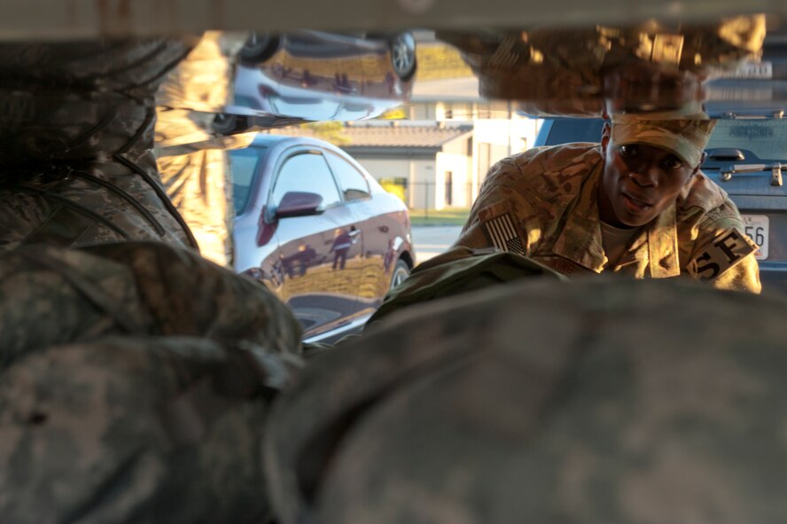 U.S. Air Force Tech. Sgt. Thomas King, 820th Base Defense Group (BDG), loads bags into the baggage bay of a bus during the 820th BDG deployment send off on Moody Air Force Base, Ga., Sept. 9, 2011. The 820th is able to deploy at a moment’s notice and this unique command element’s deployment is no different. (U.S. Air Force photo by Staff Sgt. Joshua J. Garcia/Released) 