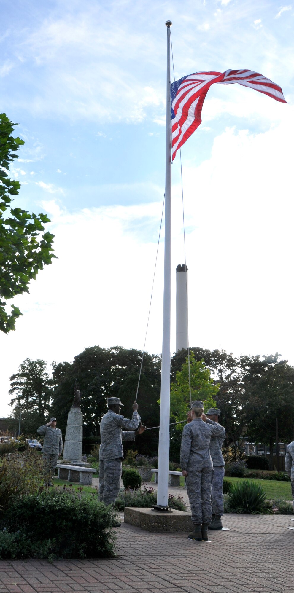 ROYAL AIR FORCE LAKENHEATH, England - Liberty Warriors conduct retreat during the 9/11 Remembrance Ceremony, Sept. 9, 2011. The ceremony was held to honor those that were lost in the attacks on Sept. 11, 2001. (U.S. Air Force photo by Senior Airman Tiffany M. Deuel)