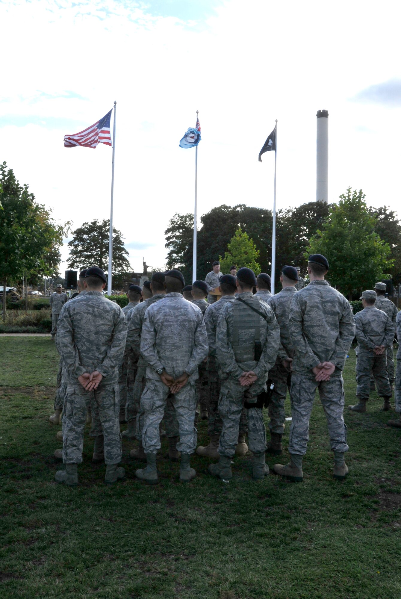 ROYAL AIR FORCE LAKENHEATH, England - Airmen of the 48th Security Forces Squadron stand in formation as Lt. Col. Paul Cairney, 48th SFS commander, speaks during the 9/11 Remembrance Ceremony, Sept. 9, 2011. The ceremony was held to honor those that were lost in the attacks on Sept. 11, 2001. (U.S. Air Force photo by Senior Airman Tiffany M. Deuel)