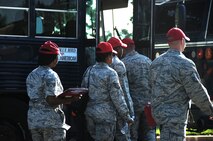 Reservists assigned to the 567th REDHORSE Squadron here, board busses Aug. 31, 2011 after being issued weapons prior to their deployment.  The 567th RHS Airmen are scheduled to spend time training in Texas before deploying to various locations in the Middle East. (USAF photo by Senior Airman Meredith A. H. Thomas, 916 ARW/PA)