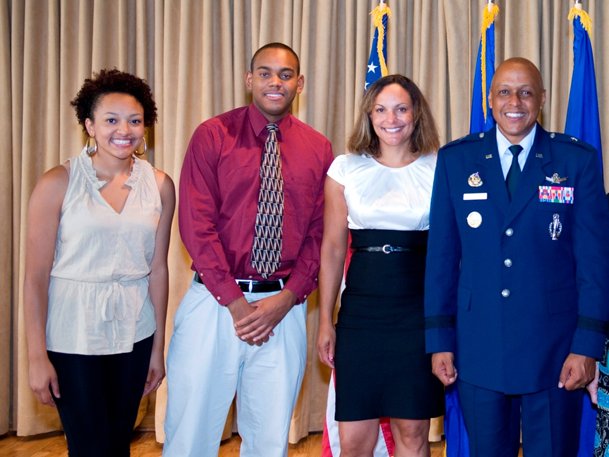 From right, 45th Space Wing Commander Brig. Gen. Anthony Cotton, wife Marsha, son Russel and daughter Brianna, at the wing’s change of command reception Aug. 30 at The Tides. (Air Force Photo/Julie Dayringer)