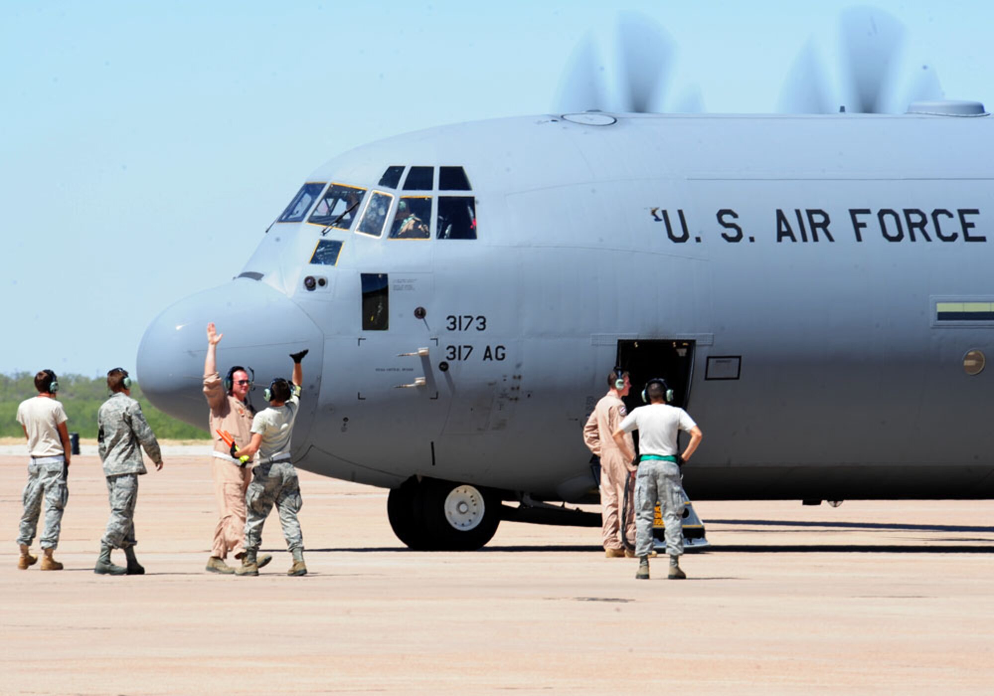 Several Dyess Airmen prepare to deploy two C-130Js for the first time Sept. 6, 2011 from Dyess AFB, Texas. The aircraft deploy in support of Overseas Contingency Operations in Southwest Asia. (U.S. Air Force photo by Airman 1st Class Peter Thompson/ Released)