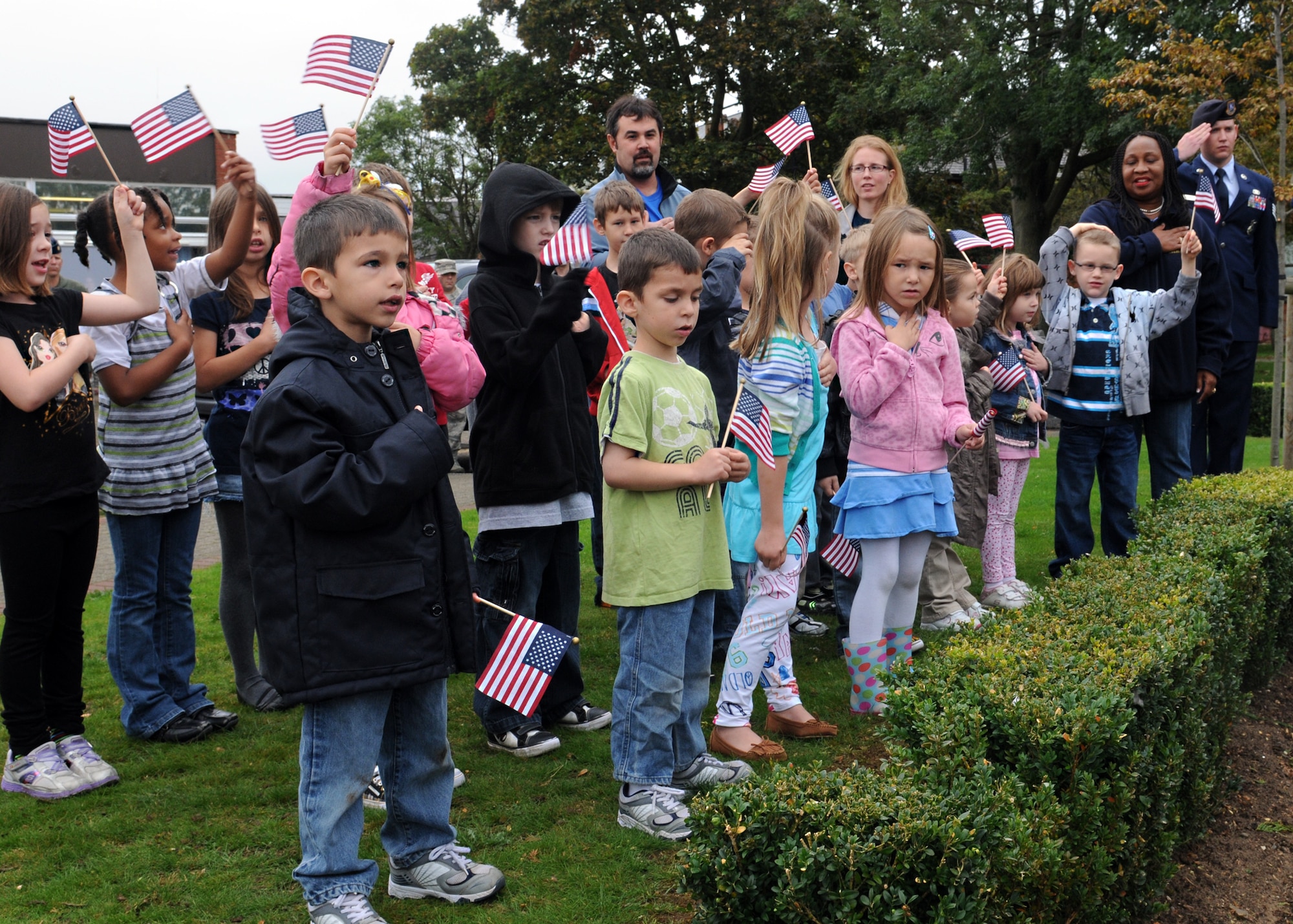 RAF MILDENHALL, England – Children from RAF Lakenheath Elementary and the RAF Mildenhall Child Development Center recite the Pledge of Allegiance during a Patriot Day ceremony here Sept. 9, 2011. The ceremony was in honor of the first responders who risked their lives to save others on 9/11. (U.S. Air Force photo by Staff. Sgt. Tabitha M. Lee)