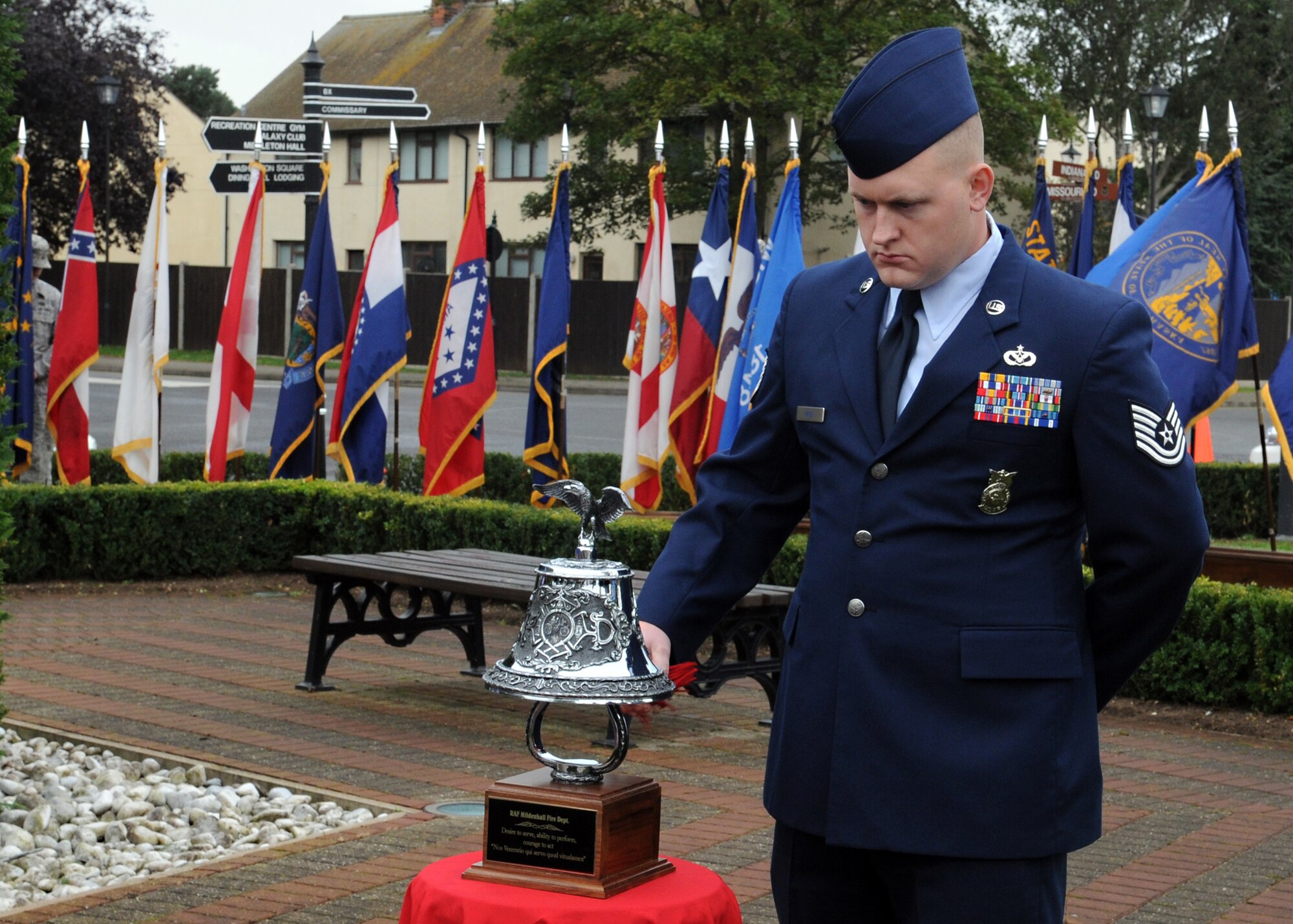 RAF MILDENHALL, England – Tech. Sgt. Joseph Mrus, 100th Civil Engineer Squadron firefighter, rings the Ceremonial Memorial Bell during a Patriot Day ceremony here Sept. 9, 2011. The bell was rang at the beginning and end of a moment of silence to honor all who have perished on or as a result of Sept. 11, 2001. (U.S. Air Force photo by Staff. Sgt. Tabitha M. Lee)
