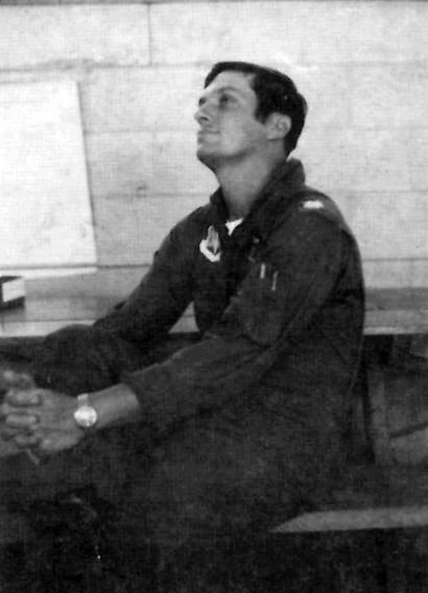He may be engrossed in a tactics briefing or perhaps just thinking about his next trip into the “wild blue yonder.” 