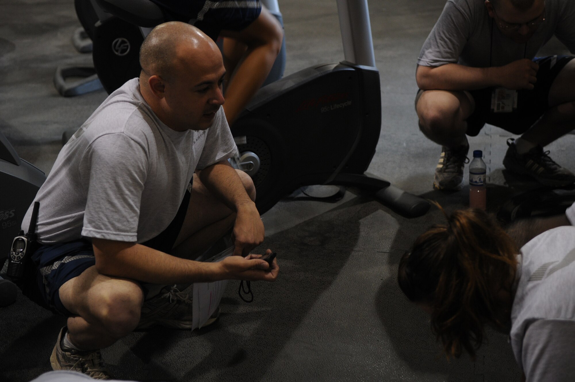 BAGRAM AIRFIELD, Afghanistan -- Master Sgt. Steven Brettler, 455th Expeditionary Force Support Squadron services flight chief, conducts a physical fitness assessment for members of the 455th Air Expeditionary Wing at the Rock Fitness Center in Camp Cunningham Sept. 8, 2011. Brettler is stationed at Joint Base Pearl Harbor-Hickam, Hawaii, and is a native of Brooklyn, N.Y. (U.S. Air Force photo/ Senior Airman Krista Rose)