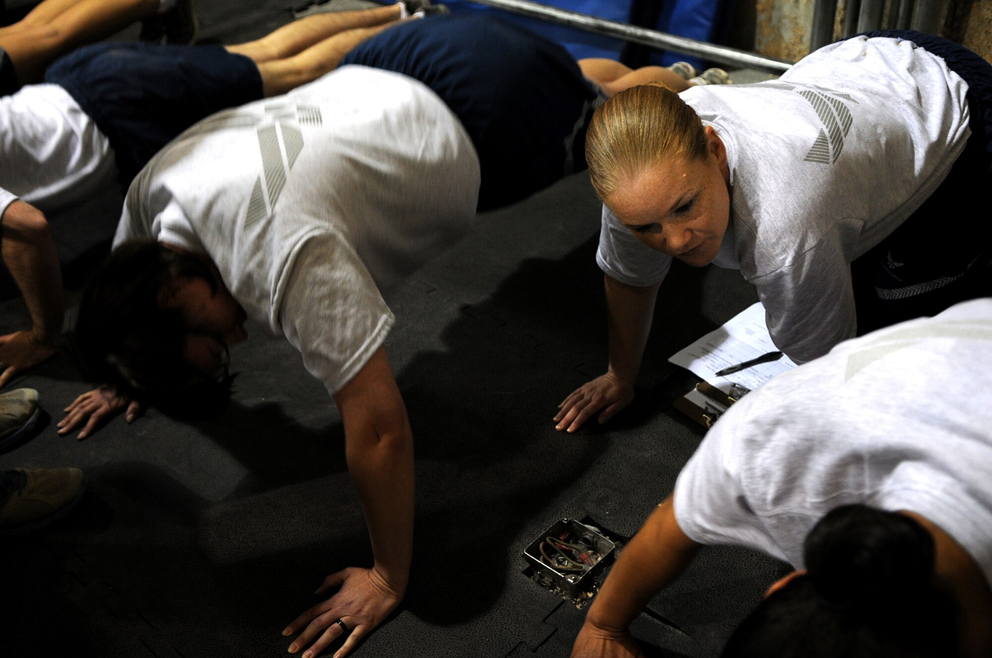BAGRAM AIRFIELD, Afghanistan -- Staff Sgt. Tonya Baugh, 455th Expeditionary Force Support Squadron services quality assurance craftsman, conducts a physical fitness assessment on members of the 455th Air Expeditionary Wing at the Rock Fitness Center in Camp Cunningham on Sept. 8, 2011. Baugh is stationed at Whiteman Air Force Base, Mo., and is a native of Charlotte, Iowa. (U.S. Air Force photo/ Senior Airman Krista Rose)
