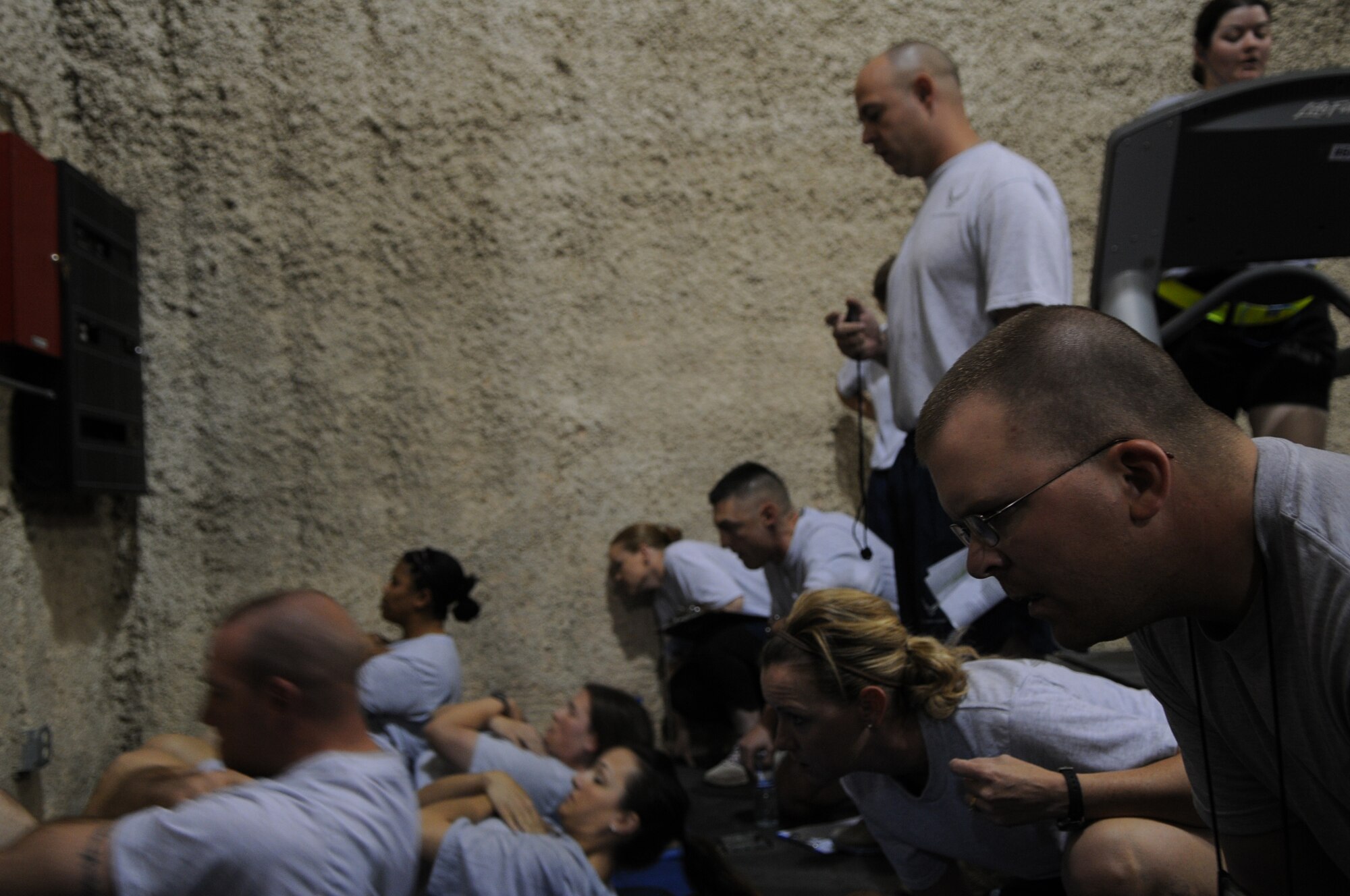 BAGRAM AIRFIELD, Afghanistan -- Master Sgt. Steven Brettler, 455th Expeditionary Force Support Squadron services flight chief, conducts a physical fitness assessment for members of the 455th Air Expeditionary Wing at the Rock Fitness Center in Camp Cunningham Sept. 8, 2011. Brettler is stationed at Joint Base Pearl Harbor-Hickam, Hawaii, and is a native of Brooklyn, N.Y. (U.S. Air Force photo/ Senior Airman Krista Rose)