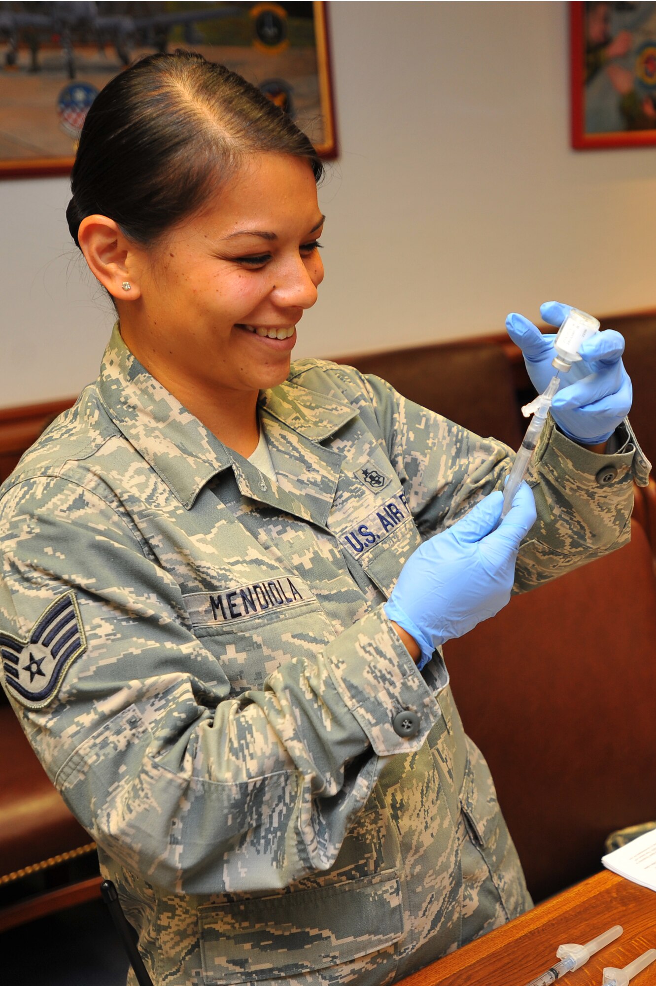 SPANGDAHLEM AIR BASE, Germany – Staff Sgt. Kelani Mendiola, 52nd Medical Operations Squadron, fills a syringe with the flu virus vaccine before a base-wide vaccination here Sept. 7. The flu mist and flu shot are annual requirements for service members and their families. Active-duty military members at Spangdahlem were required to receive the vaccination by Sept. 8 and family members will be able to get their vaccinations Sept. 19.  (U.S. Air Force photo/Airman 1st Class Dillon Davis)