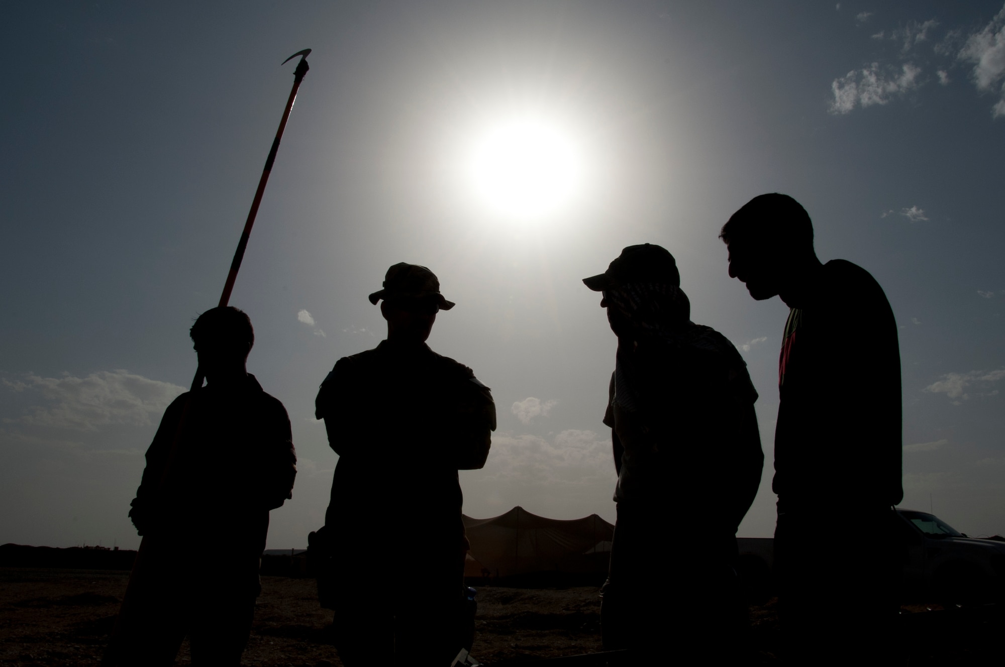 CAMP DWYER, Afghanistan -- Members of the Afghan National Army and Air Force EOD team and a translator discuss possible procedures to defeat a simulated improvised explosive device at Camp Dwyer, Afghanistan, Sept. 3, 2011. As the trainers, the Air Force EOD team can assist the ANA team to train them on the most current counter-IED procedures. (U.S. Air Force photo by Senior Airman David Carbajal)