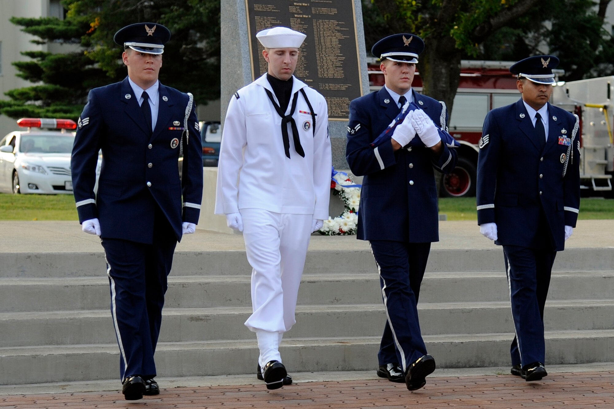 MISAWA AIR BASE, Japan - Members of the Misawa Air Base honor guard retires the colors during the Patriot Day ceremony at the base flag pole here Sept 9. The ceremony served as a time to honor the victims and first responders in the 9/11 terrorist attacks. (U.S. Air Force photo/Tech. Sgt. Marie Brown)