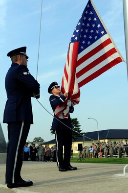 MISAWA AIR BASE, Japan - The Misawa Air Base honor guard lowers the flag during the Patriot Day ceremony held at the base flag pole here Sept. 9. This year marks the 10th anniversary of the terrorist attacks against the World Trade Center and Pentagon, which killed more than 2,000 people. (U.S. Air Force photo/Tech. Sgt. Marie Brown)