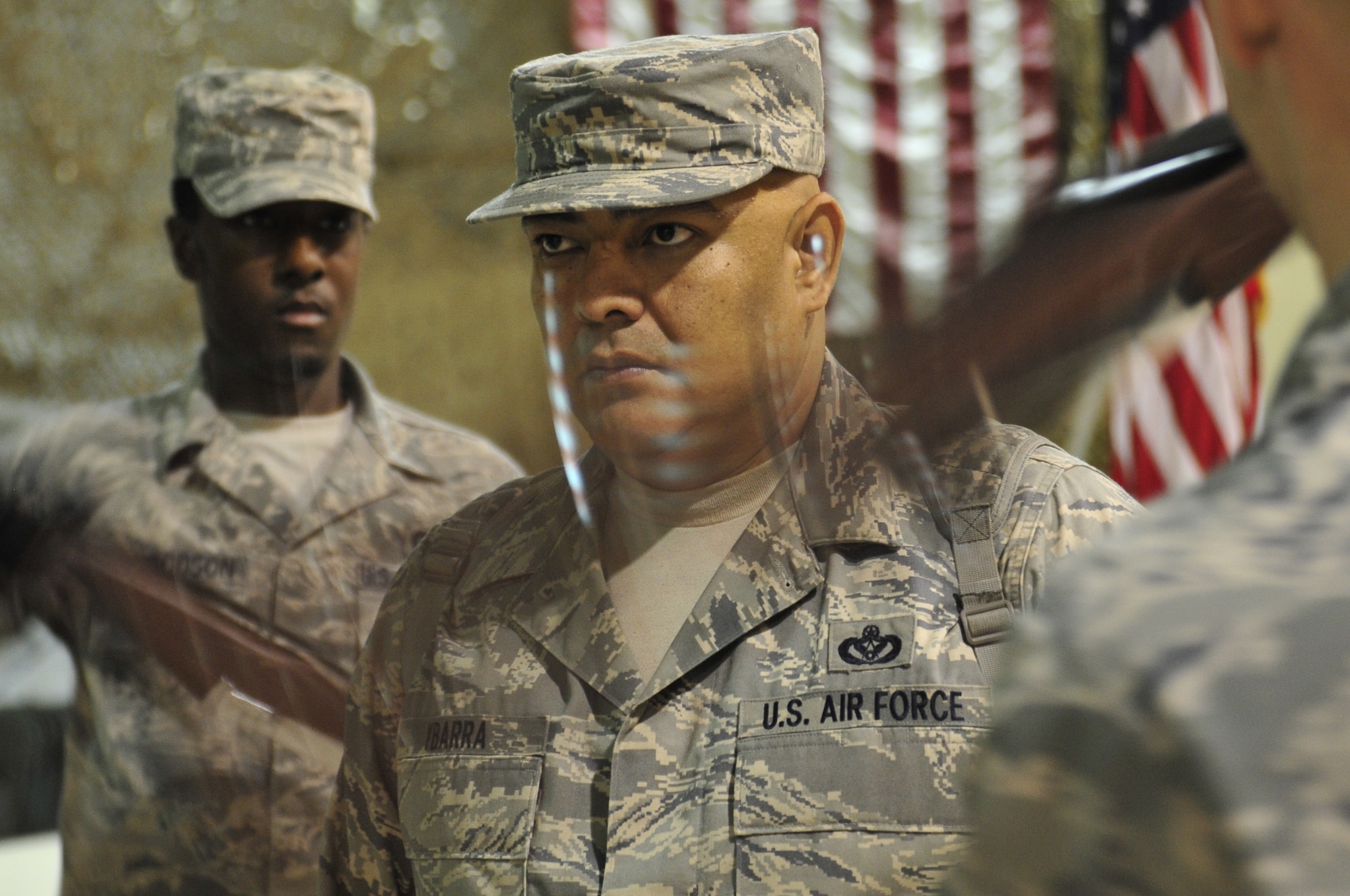 Master Sgt. Herman Ybarra stands in the middle of the four-man drill team while his 407 Air Expeditionary Group Honor Guard practices for their 9/11 ceremony at Ali Base, Iraq on Aug. 28, 2011.  Sergeant Ybarra is deployed from Vandenberg Air Force Base, Calif., and is a native of Corpus Christi, Texas. (U.S. Air Force photo/Master Sgt. Cecilio Ricardo)