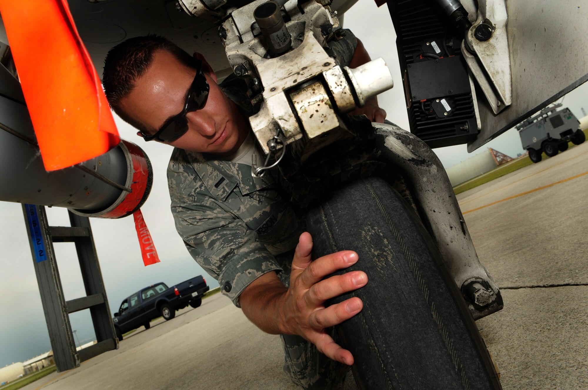 First Lt. Matt Larson, Gambler Aircraft Maintenance Unit officer in charge, inspects an F-16 Fighting Falcon tire as part of an exceptional release inspection prior to a combat mission July 7 at Aviano Air Base, Italy. The Gambler AMU and the 77th Expeditionary Fighter Squadron from Shaw Air Force Base, S.C., supported the Operation Unified Protector for more than five months in enforcement of United Nations Security Council Resolutions 1970 and 1973. The goal of Operation Unified Protector is to protect civilians and civilian-populated areas in Libya under attack or threat of attack. The mission is focused on three main areas: an arms embargo, a no-fly-zone and actions to protect civilians from attack or the threat of attack. (U.S. Air Force photo/Staff Sgt. Julius Delos Reyes)