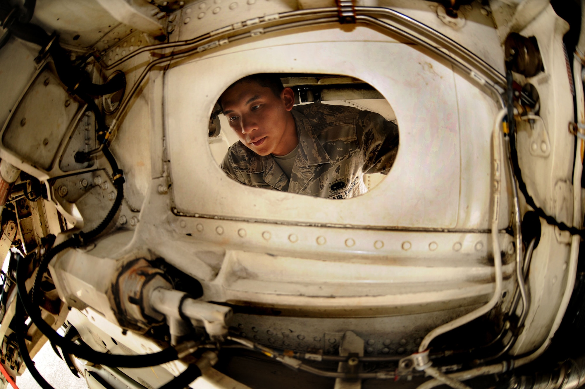 Airman 1st Class John Kulwatno, Gambler Aircraft Maintenance Unit crew chief, performs a basic post-and pre-flight inspection on an F-16 Fighting Falcon July 7 at Aviano Air Base, Italy. The Gambler AMU and the 77th Expeditionary Fighter Squadron from Shaw Air Force Base, S.C., supported Operation Unified Protector for more than five months from Aviano Air Base, Italy in enforcement of United Nations Security Council Resolutions 1970 and 1973. The goal of Operation Unified Protector is to protect civilians and civilian-populated areas in Libya under attack or threat of attack. The mission is focused on three main areas: an arms embargo, a no-fly-zone and actions to protect civilians from attack or the threat of attack. (U.S. Air Force photo/Staff Sgt. Julius Delos Reyes)