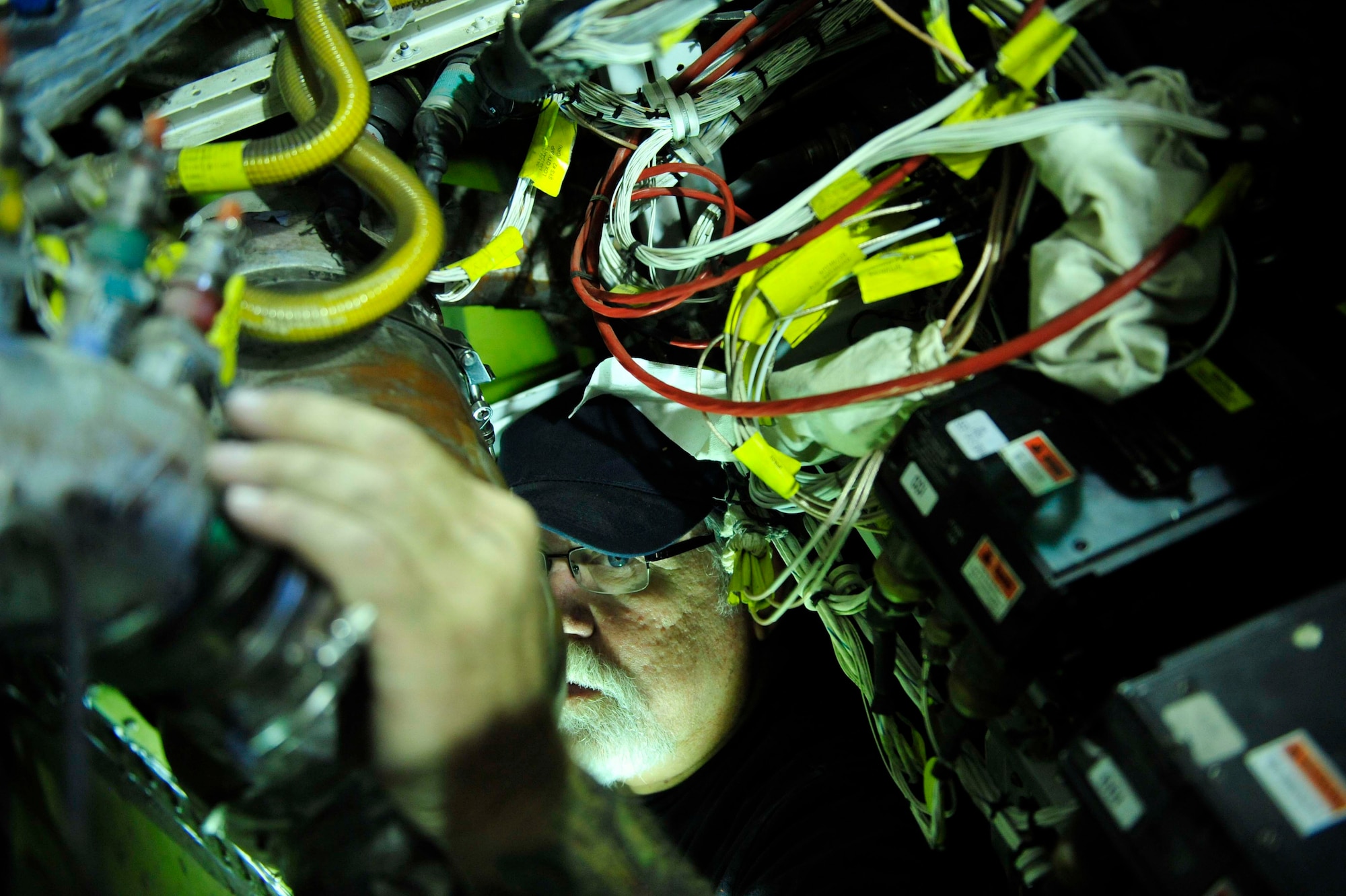 David  Hall, a member of the Lockheed Martin Aeronautics phase team conducts, a regularly-scheduled deep-dive inspection of a U-2, Sept.1, 2011, at an air base in Southwest Asia. The inspection takes the team of 14 civilians 19 days from start to finish and encompasses 450 special inspection items that are critical to keeping the aircraft flying. Conducting the inspection at the deployed wing returns the aircraft to the mission sooner, officials said.  (U.S. Air Force photo/Tech Sgt. Patrick Mitchell)