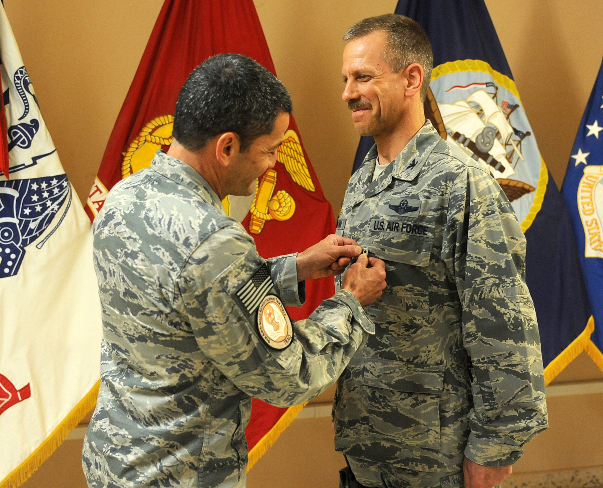 Col. Tom Fuhrmann, right, receives a military decoration from Maj. Gen. Russ
Handy, the commander, 9th Air and Space Expeditionary Task Force-Iraq, and
director, Air Component Coordination Element-Iraq, during a ceremony Sept.
2, 2011, at Al Asad Air Base, Iraq. During his six-month deployment
supporting Operation New Dawn in Iraq, Colonel Fuhrmann was responsible for
integrating air component sustainment and transition efforts. Colonel
Fuhrmann is a member of the Air Force Reserves and is stationed at the
Pentagon. (U.S. Air Force photo/Senior Airman Tristin English)
