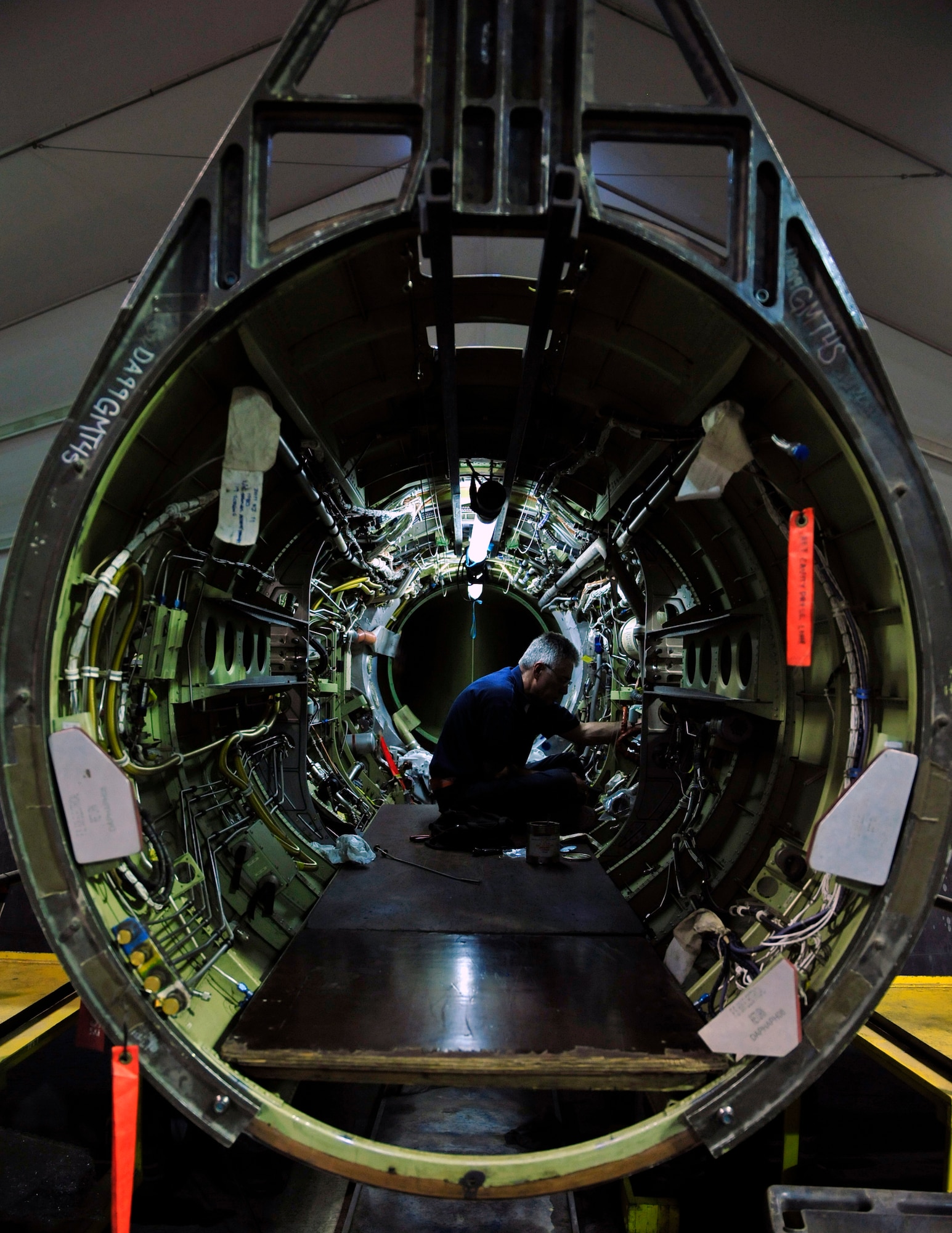 A member of the Lockheed Martin Aeronautics phase team sits inside of a U-2 as he conducts a regularly-scheduled deep-dive inspection of the aircraft Sept. 1, 2011 at an air base in Southwest Asia. The inspection takes the team of 14 civilians 19 days from start to finish and encompasses 450 special inspection items that are critical to keeping the aircraft flying. Conducting the inspection at the deployed wing returns the aircraft to the mission sooner, officials said.   (U.S. Air Force photo/Tech Sgt. Patrick Mitchell)