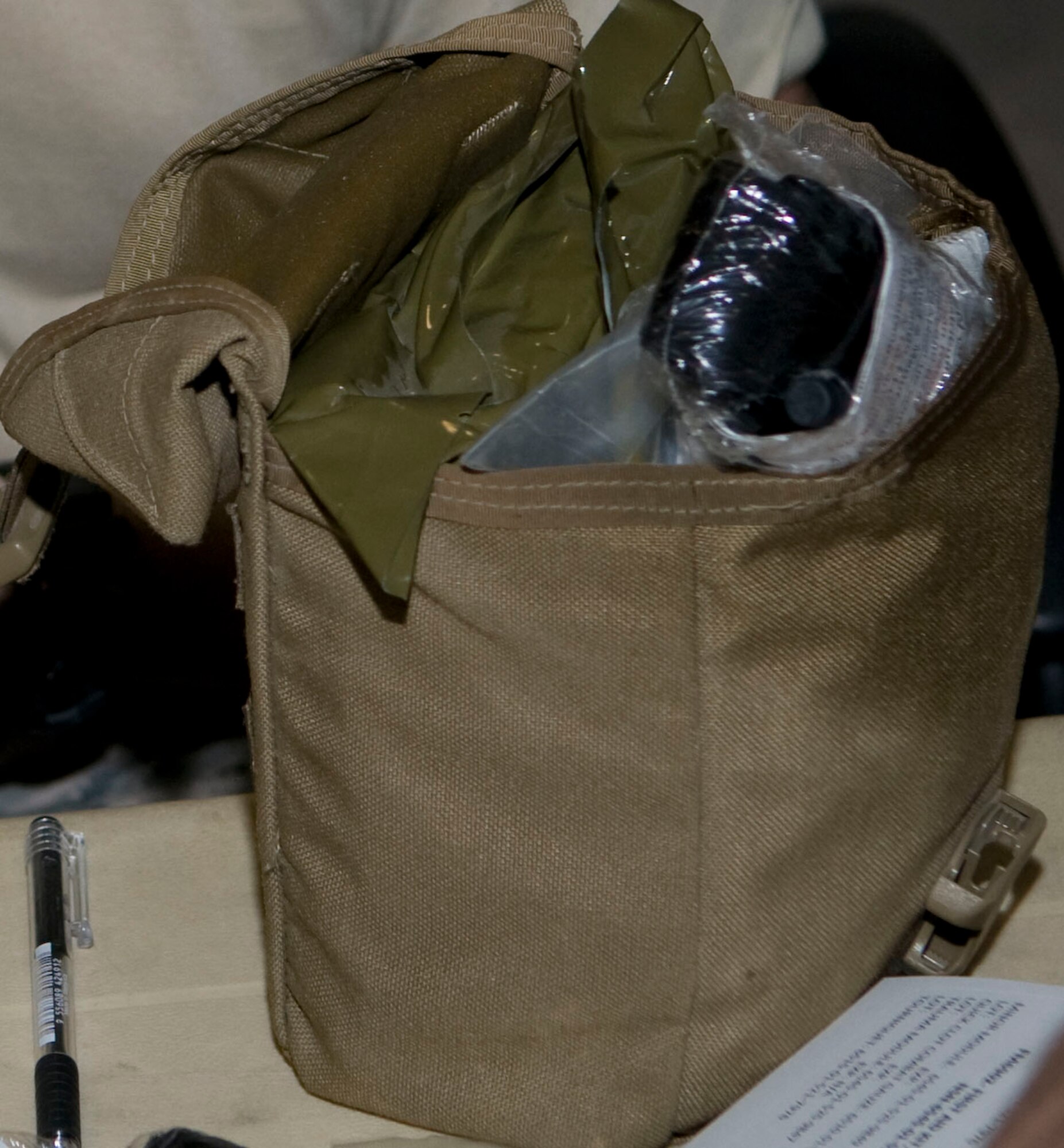 An individual first aid kit is often used during the first tier of care on the battlefield and its contents are designed to help save lives. (U.S. Air Force photo/Senior Airman Eric Summers Jr.)