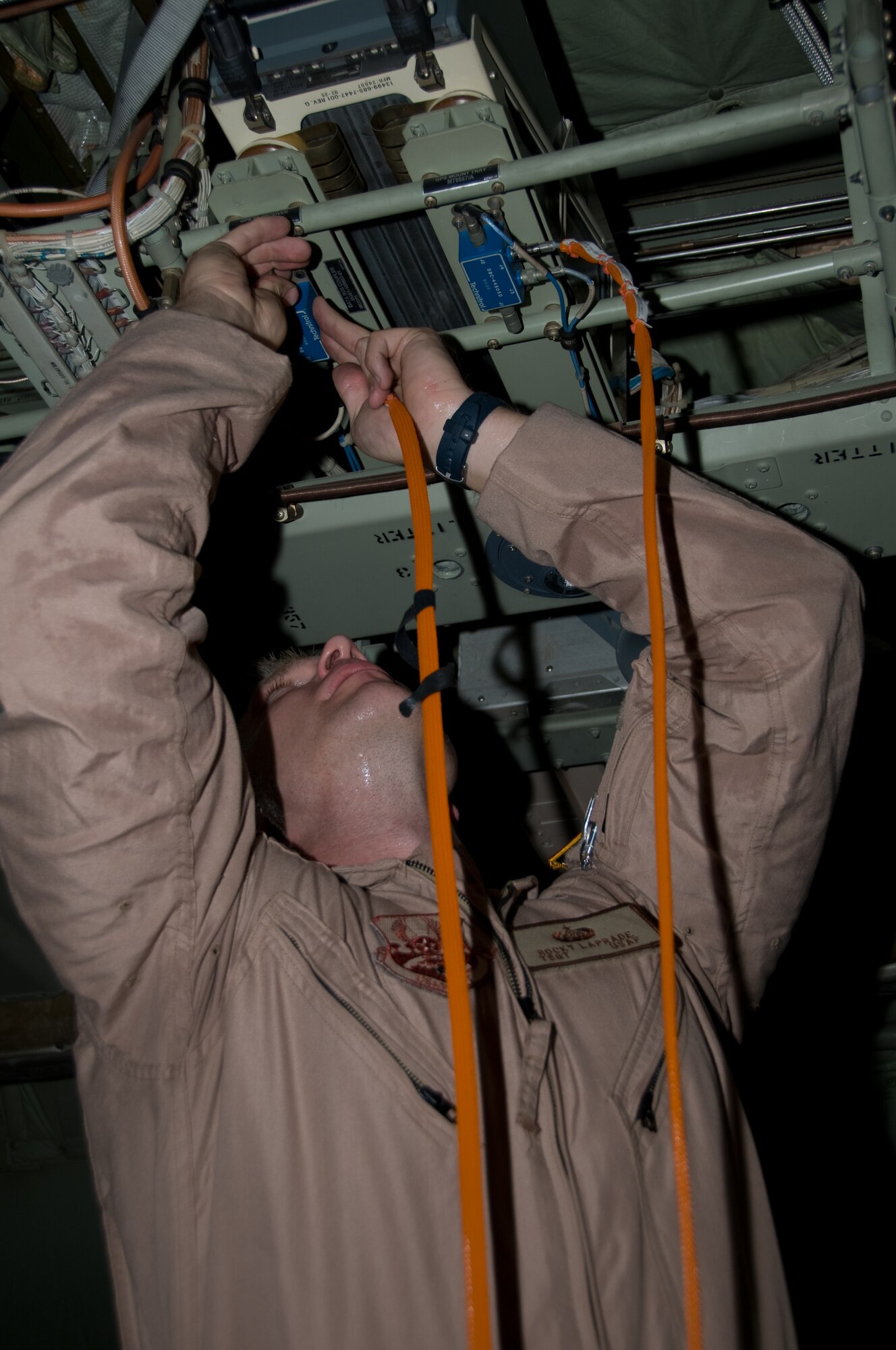 Tech. Sgt. Rocky Laprade, 379th Expeditionary Communications Squadron viper team, connects the Viper System Communication Suites to a data hub onboard a C-130 Hercules, Aug. 26. (U.S. Air Force photo/Senior Airman Eric Summers Jr.)