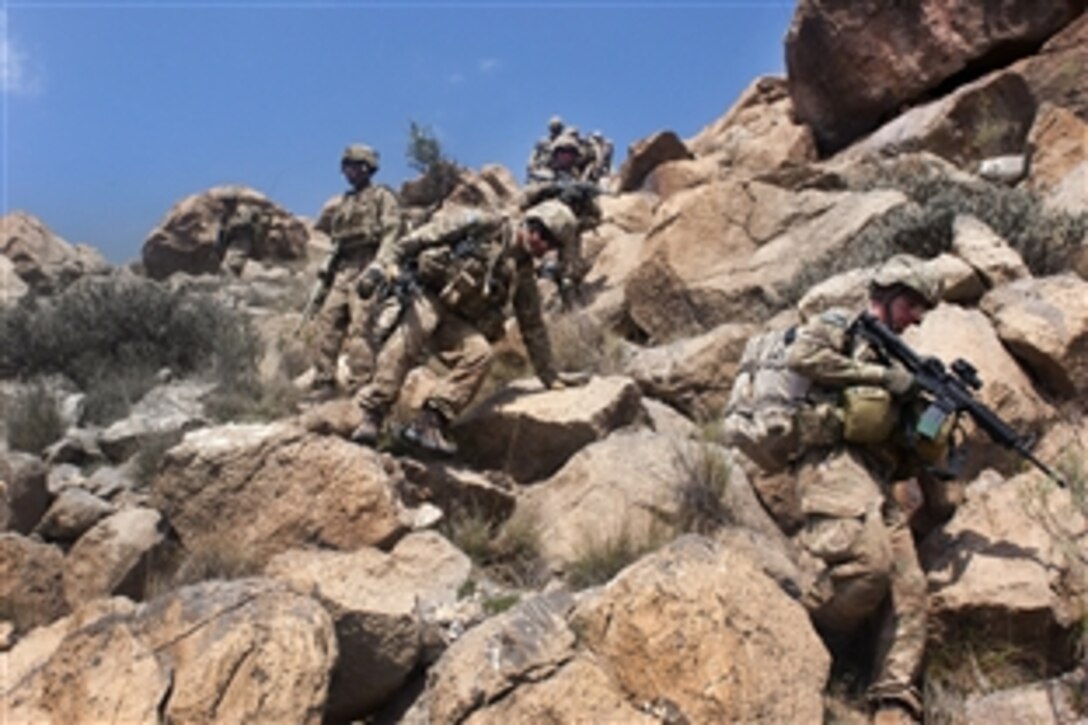 U.S. Army soldiers begin their descent from the summit of "Big Nasty," a mountain in Paktika province, Afghanistan, Sept. 8, 2011. The soldiers are assigned to Company C, 3rd Battalion, 66th Armor Regiment, 172nd Infantry Brigade. The unit was on a joint mission with the Afghan army and border patrol in the mountains near the Pakistan border.