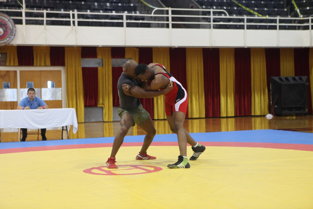 Two Marines duke it out during a freestyle wrestling invitational held by the All-Marine Wrestling Team, Sept. 10, at the Goettge Memorial Field House aboard Marine Corps Base Camp Lejeune. While the double-elimination tournament allowed wrestlers to come out, have a good time and let off some steam, it also gave the AMWT a chance to do a little scouting.