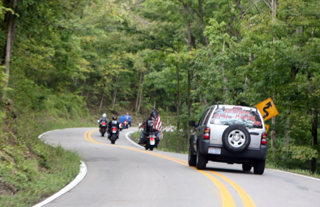 Motorcyclists glide along a winding road in Versailles, Ind., during a memorial ride September 10, 2011, in honor of Cpl. John C. Bishop, who was killed in action in Afghanistan. Bishop was serving as an infantryman with 2nd Battalion, 9th Regiment, 2nd Marine Division, at the time of his death. (U.S. Marine Corps photo by Pfc. Franklin E. Mercado)