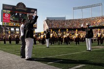 Capt. Jacob C. Aldean, Marine Corps Officer Selection Station Twins Cities, administers the oath of office to three lieutenants during a reaffirmation ceremony at TCF Bank Stadium Sept. 10. The ceremony was part of the Minnesota Gophers halftime show. Aldean is 35-year-old Woodbury, Minn., native. For additional imagery from the event, visit www.facebook.com/rstwincities.