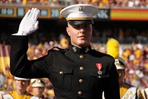 2nd Lt. Steven J. Nooyen, 22, from DeForest, Wis., reaffirms his oath of office during the Minnesota Gophers halftime show at TCF Bank Stadium Sept. 10. Nooyen will enter the active duty ranks next month and begin his tour of duty at Marine Corps Base Quantico, Va., for the Basic Officer Course, also known as "The Basic School." For additional imagery from the event, visit www.facebook.com/rstwincities.